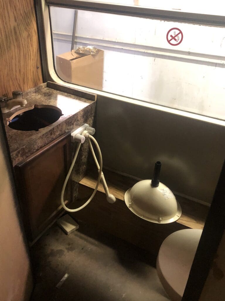 A bathroom with a sink and toilet in it